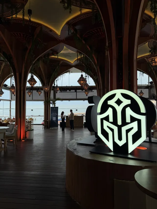 The lit AdGuardians logo inside the venue